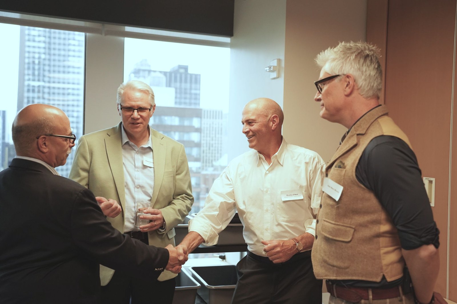 Murphy O'Neal at the Royal Norwegian Consulate General in New York City, April 28 2026, in conversation with other industry attendees at the Hydro × Parsons Healthy Materials Lab Masterclass.